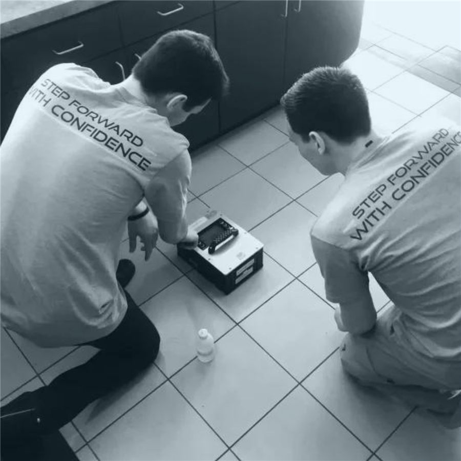 WMG technicians testing floor slip resistance with the BOT-3000E tribometer