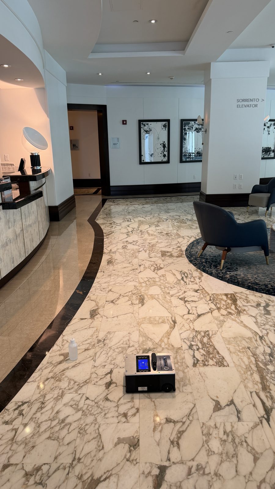 BOT-3000E on marble flooring at an elevator lobby