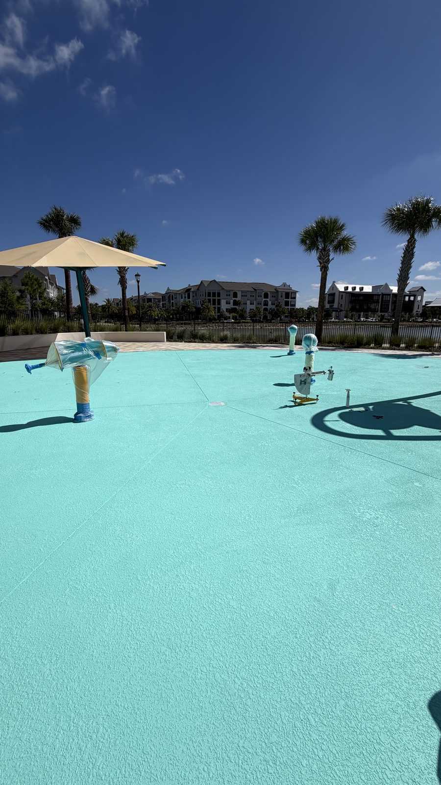 Pendulum Slip Tester on a turquoise splash pad deck