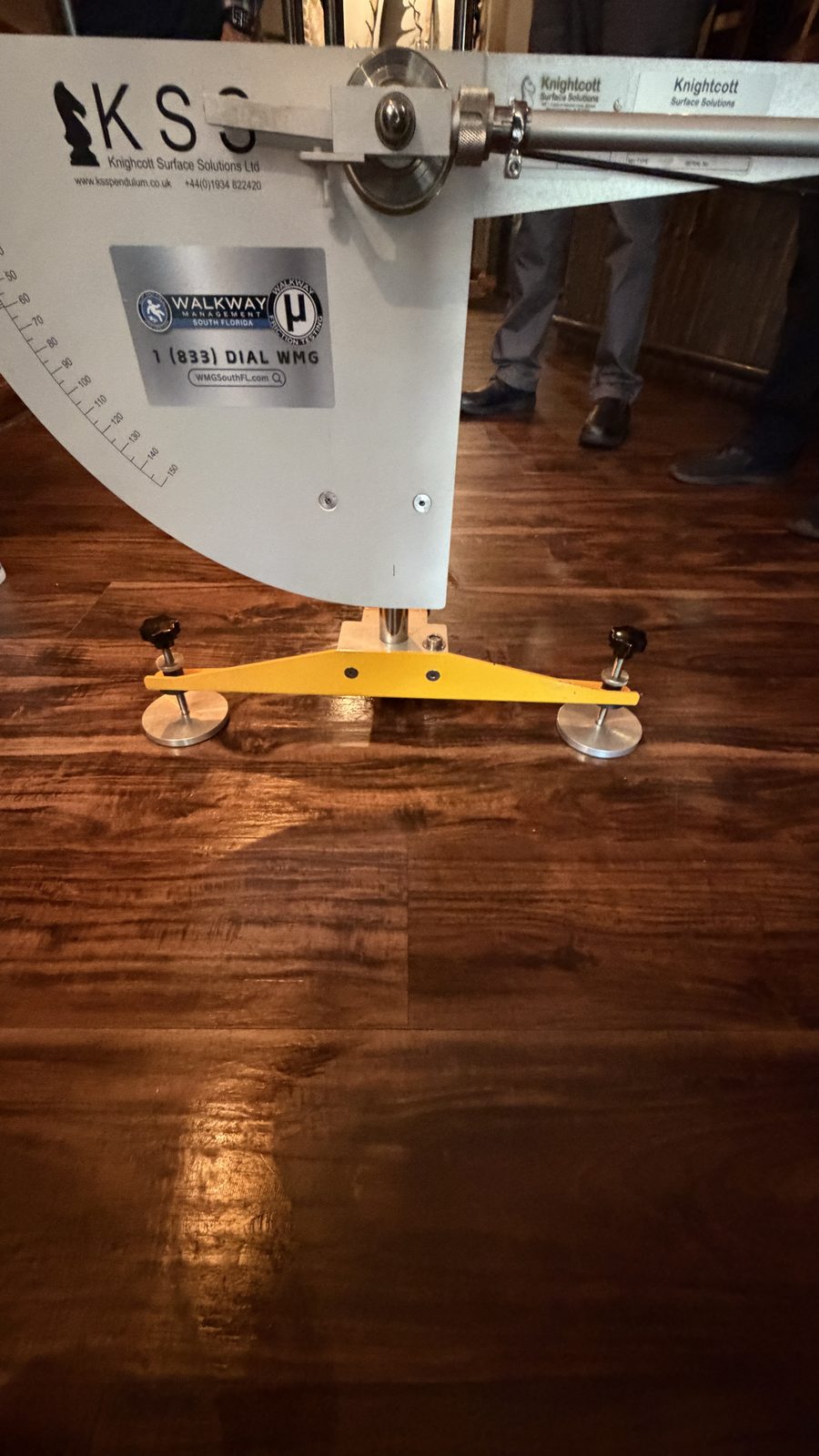 Close-up of the Pendulum Slip Tester on a polished wood floor
