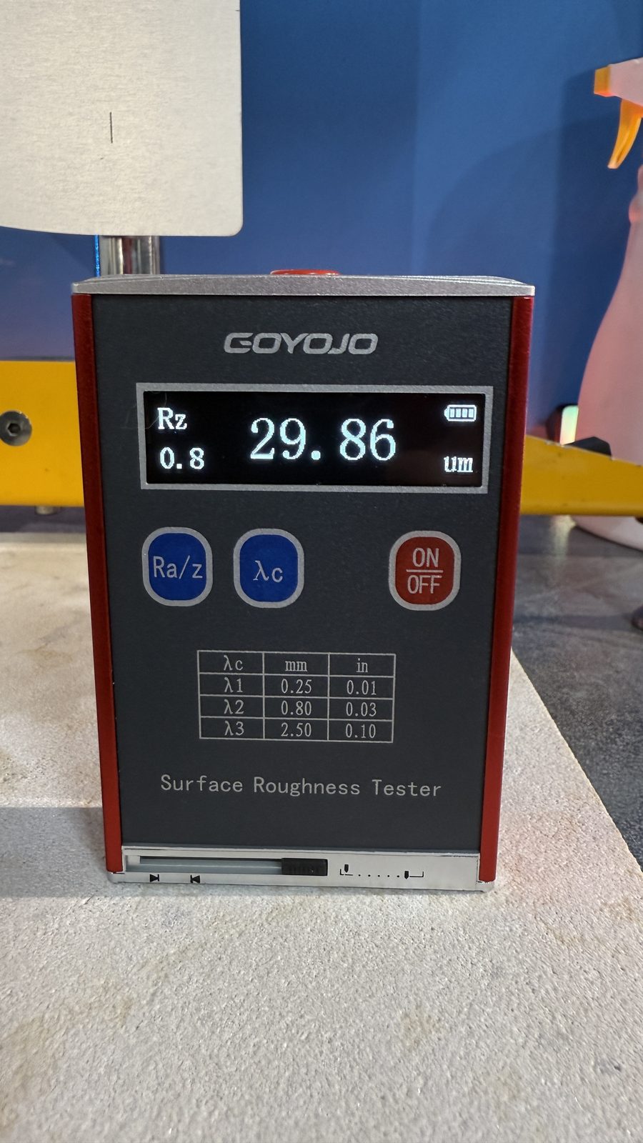 Surface roughness tester showing a live Rz measurement on a floor