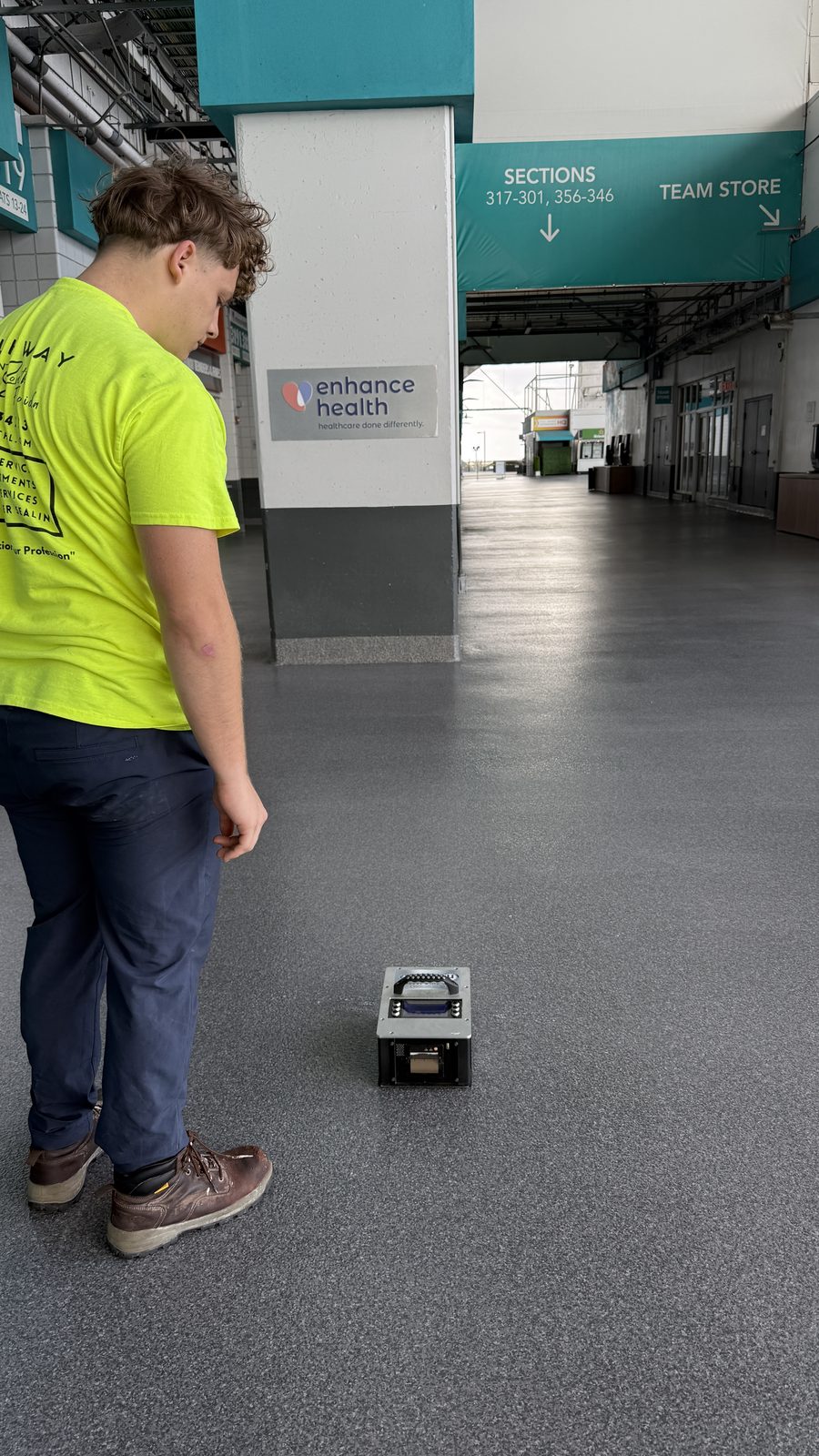 Technician running a BOT-3000E test on a commercial floor