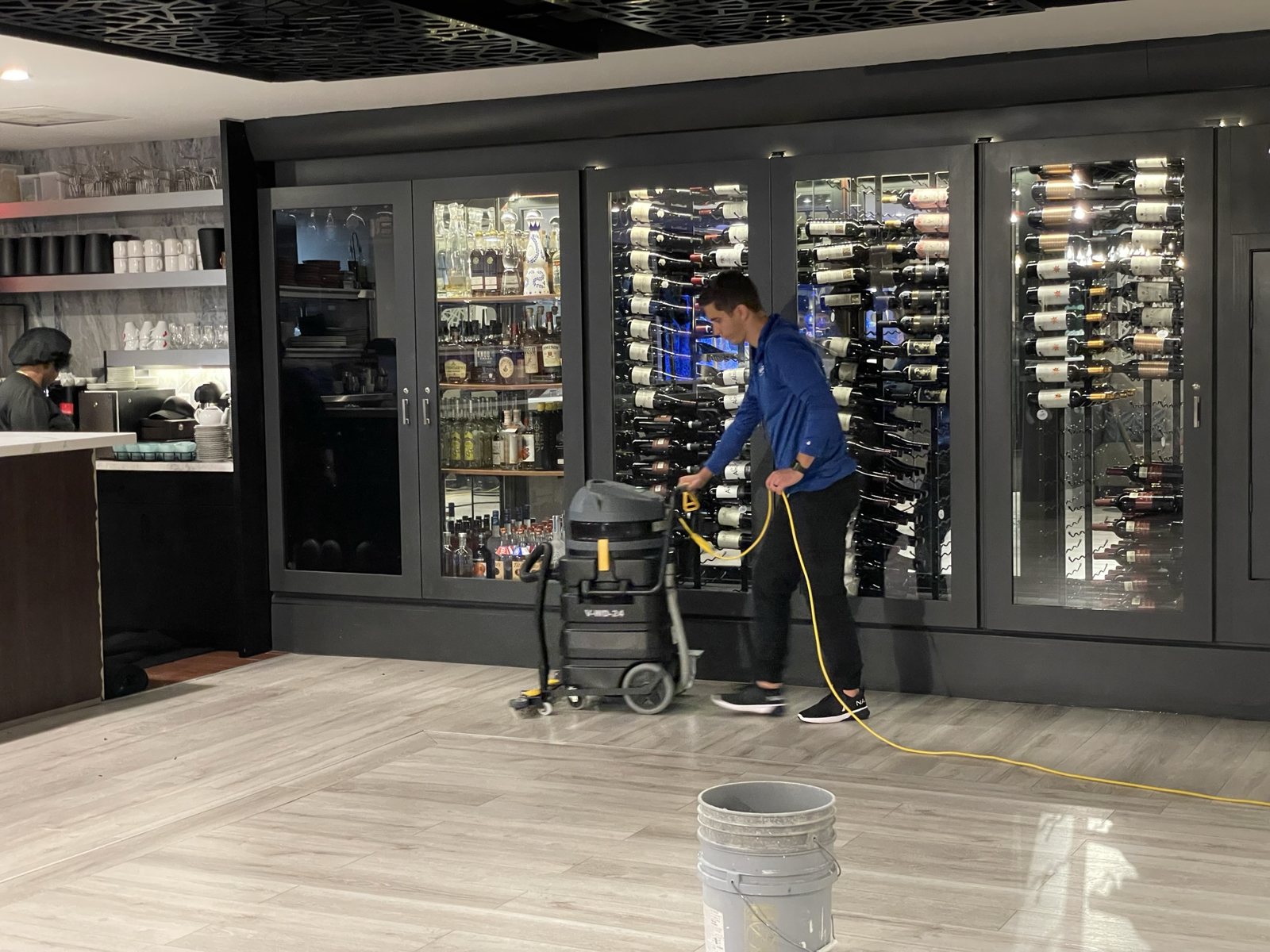 Machine-buffing a treated floor.