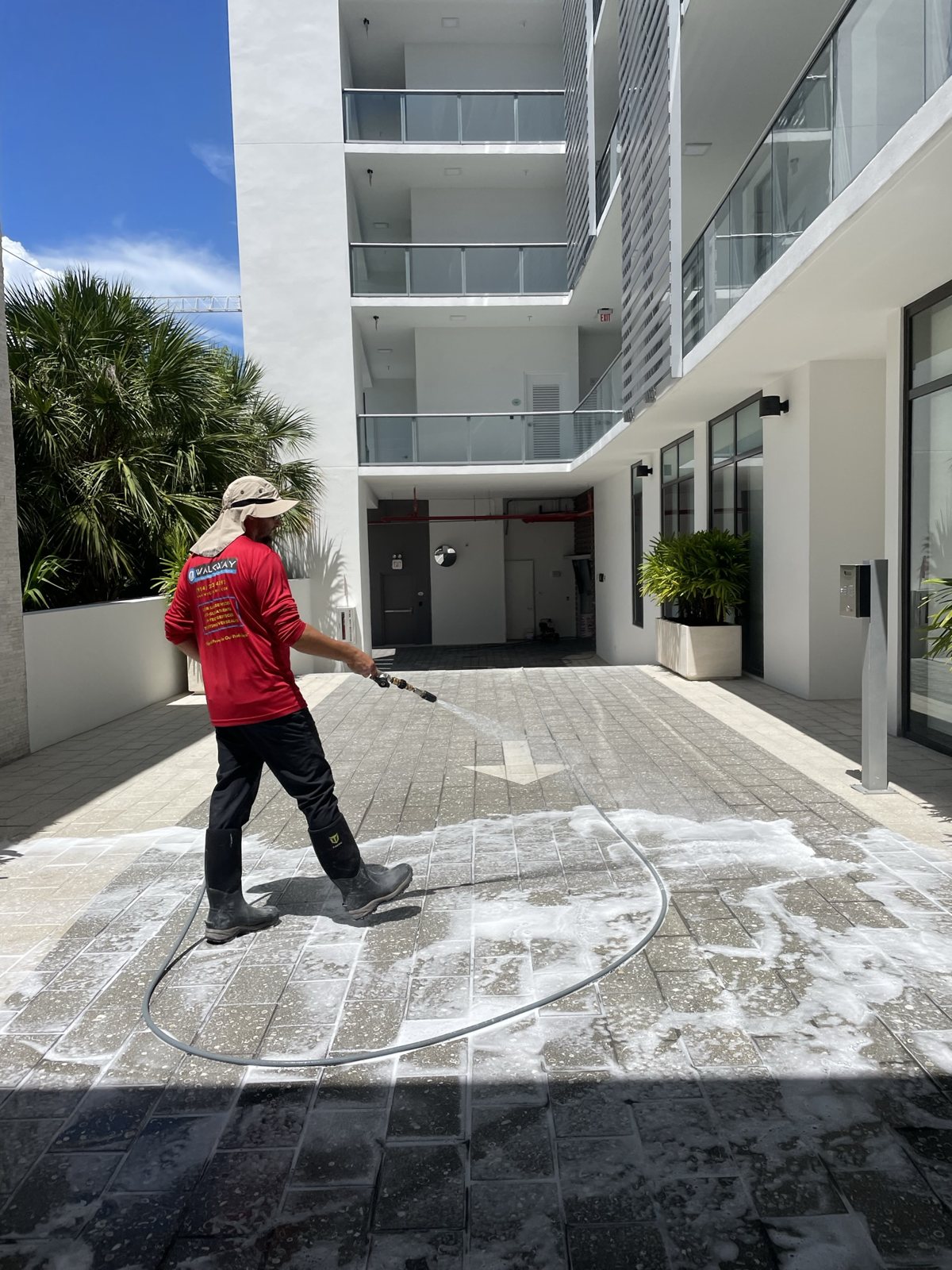 Applying a traction treatment to a courtyard.