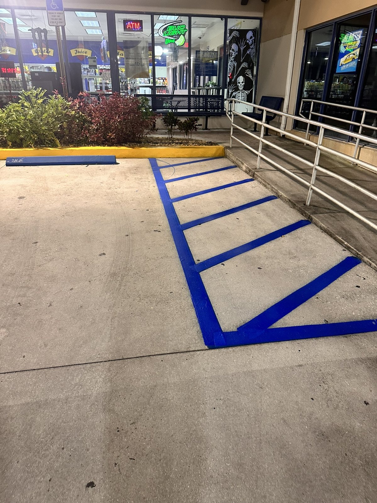 An accessibility ramp, striped and treated.