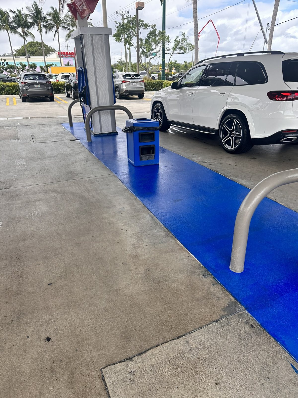 A coated walkway at a dealership.