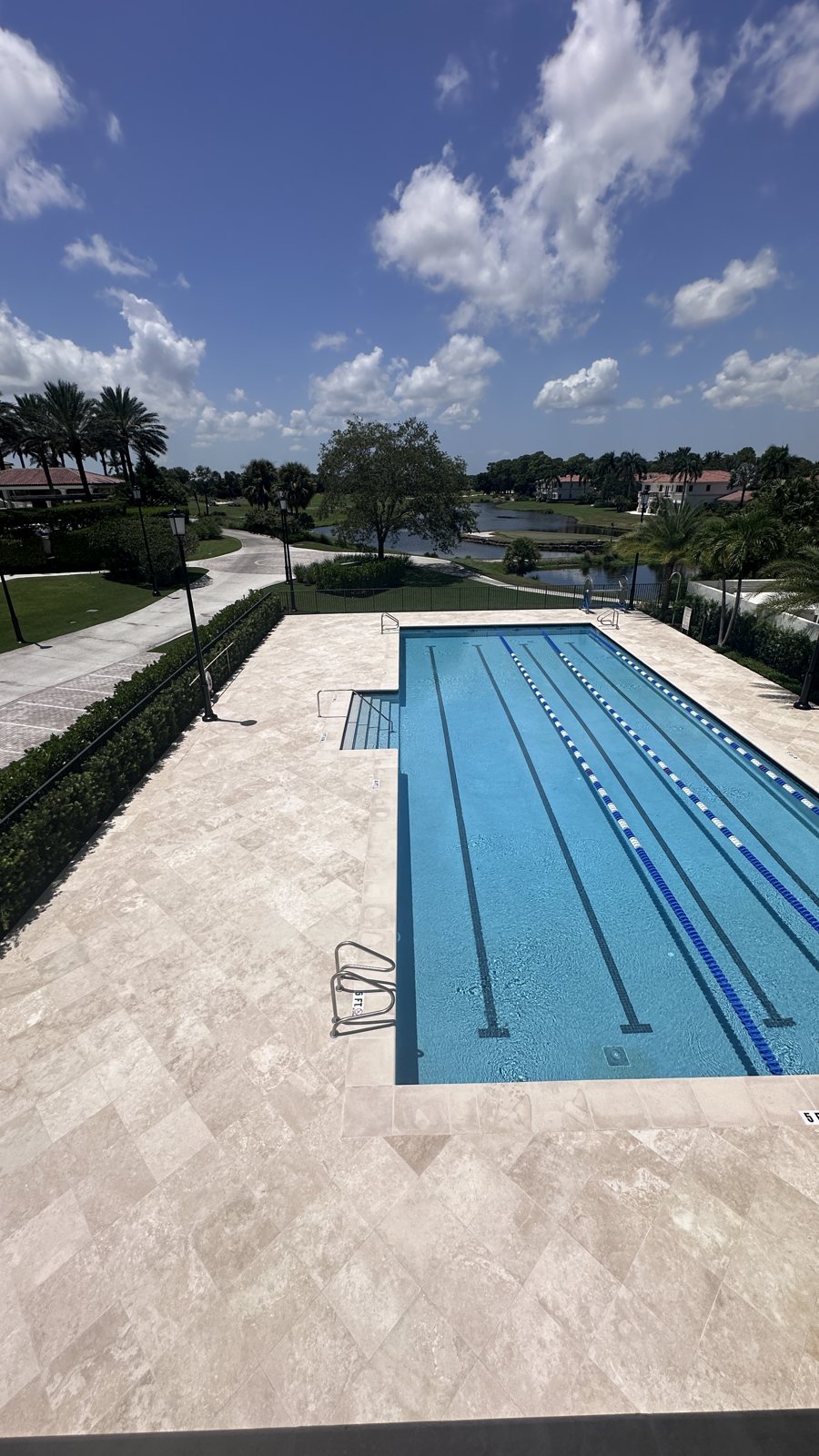 A finished travertine pool deck.