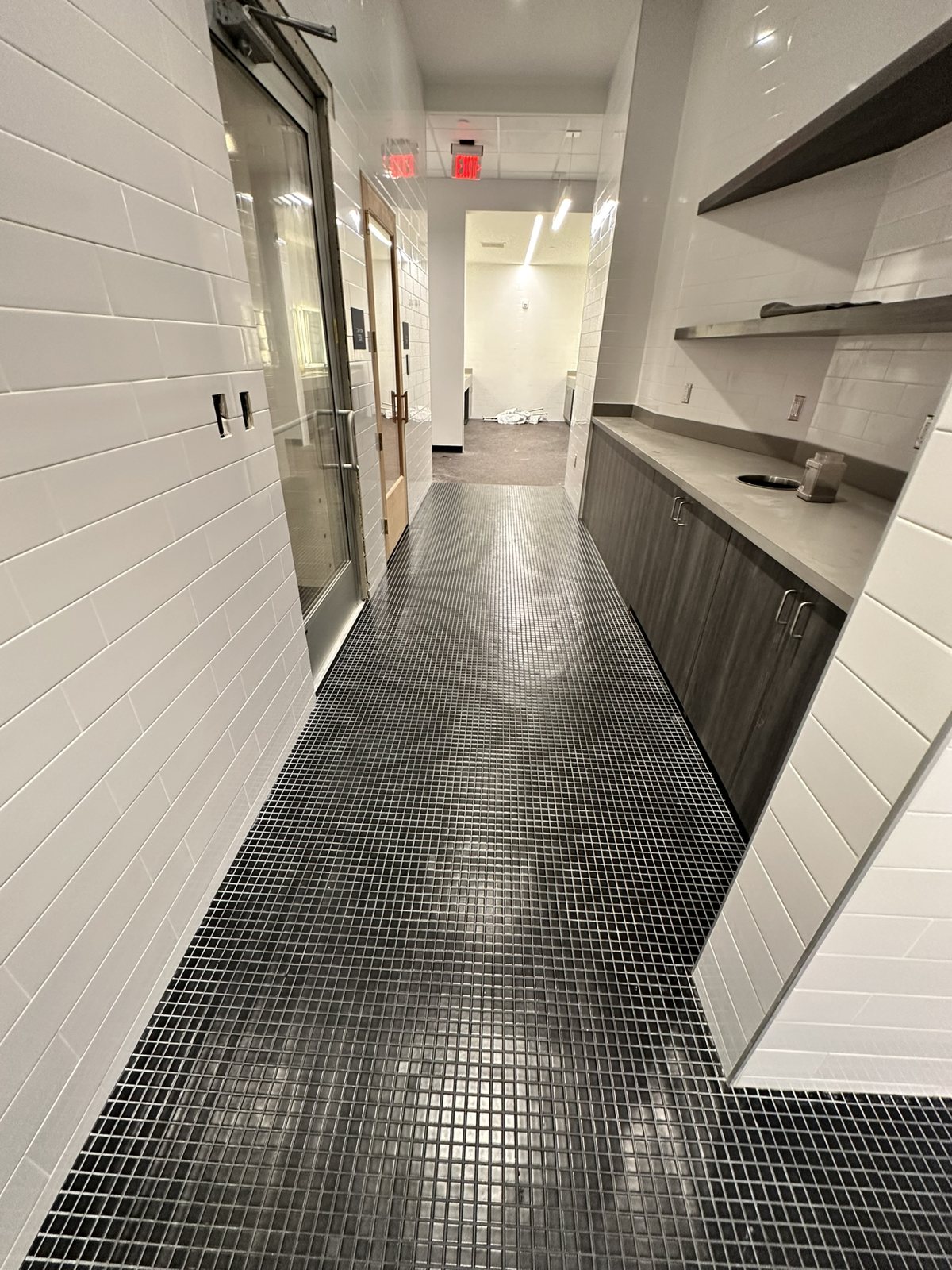 A mosaic-tile corridor.