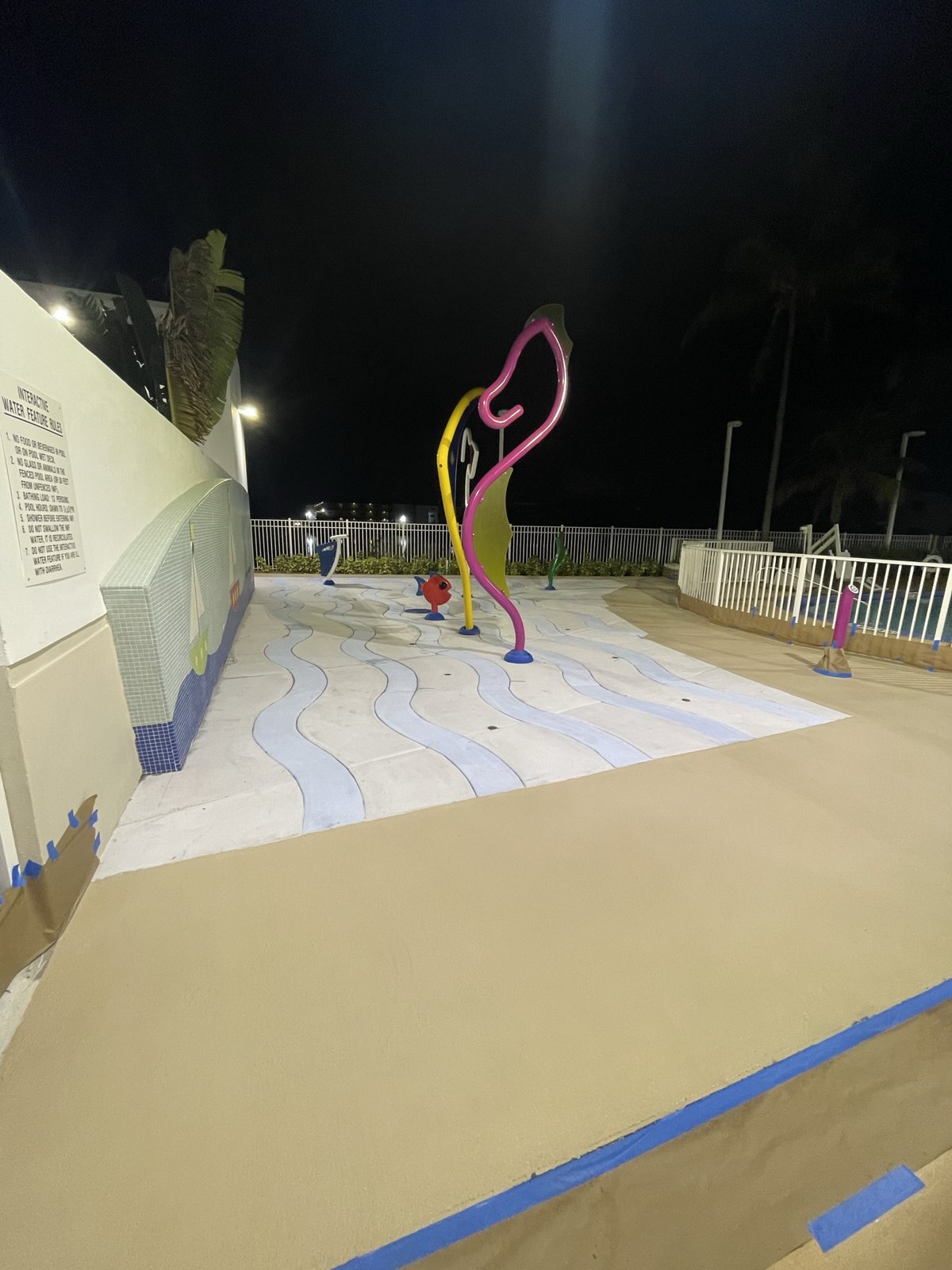 A resort pool deck at night.