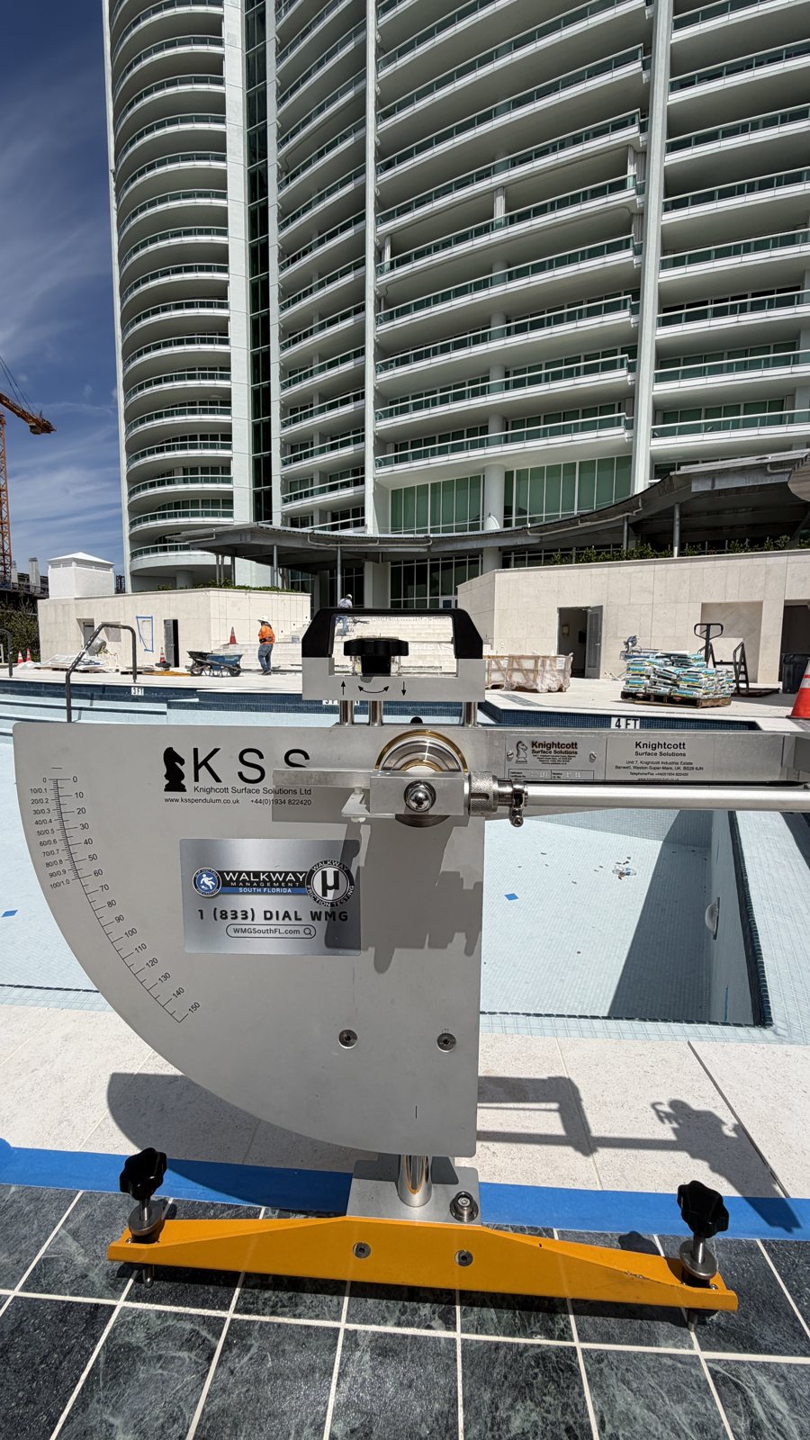 Pool-deck testing beneath a high-rise.