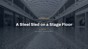 Large reflective floor with the headline A Steel Sled on a Stage Floor